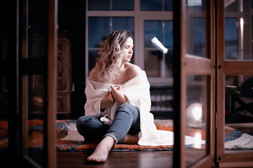 sexy glamorous girl evening at home / adult sexy model on a dark background, evening at home, concept of female sexuality