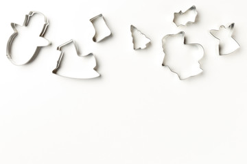 Christmas cookies various shape cutter on white background with copy space. Top view. Flat lay. Christmas concept