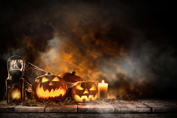 Halloween pumpkins on wooden planks.