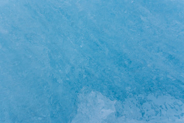 Blue ice texture, winter background, texture of ice surface.