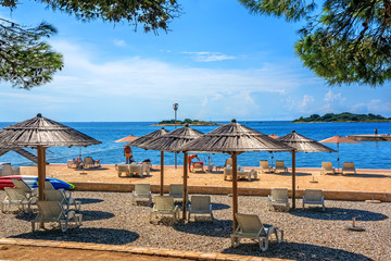 umbrellas and sun loungers on the beautiful European beach