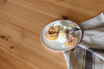  Delicious breakfast in a rustic style. Snack from apples. Baked apples with creamy ice cream