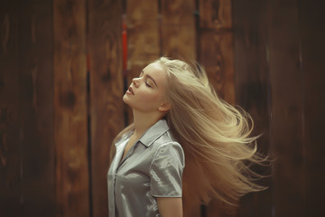 Obraz na płótnie Canvas Home portrait of a young blonde girl