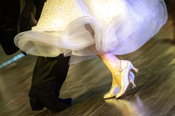 closeup of ballroom dancers legs