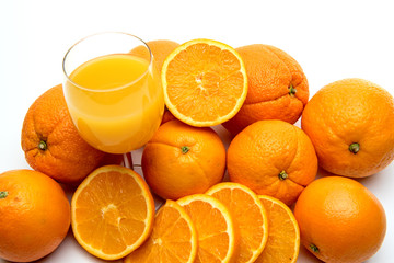 Juice glass and orange fruit isolated on white background
