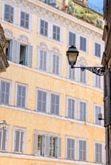 Fototapeta na wymiar View of old building and windows in historical centre of Rome - Italy