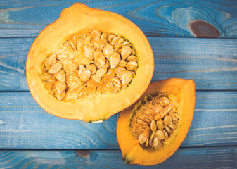 Pumpkins on rustic blue background. Autumn background.