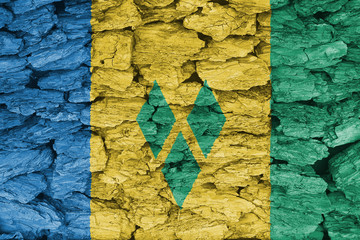 Texture of the flag of Saint Vincent and the Grenadines on a decorative tree bark.