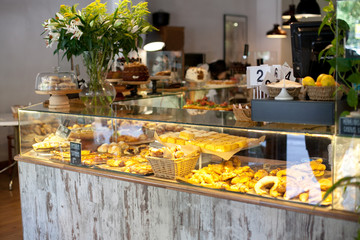 Modern display of bakery with different kinds of cookie and buns