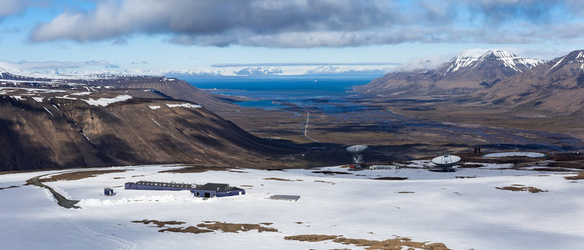 Distant research facility in arctic mountains of Svalbard