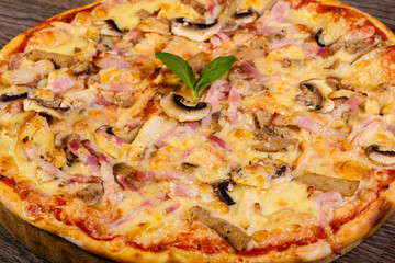 Pizza with ham and mushrooms