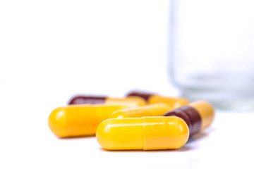 Medicine green and yellow pills or capsules