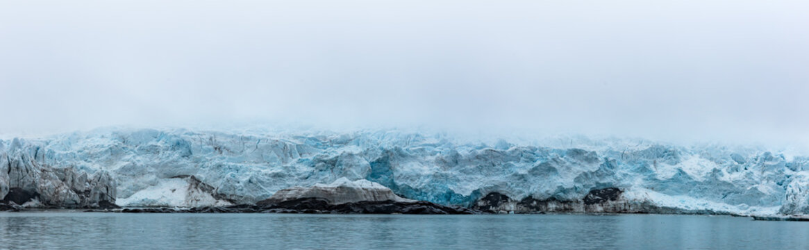 Blue massive iceberg in the Barents sea