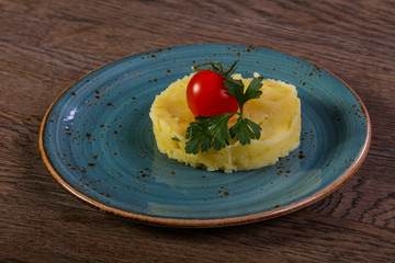 Mashed potato served tomato