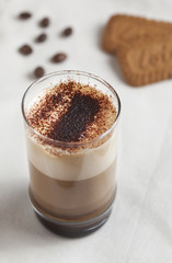 mixed coffee with cookie on a white texture