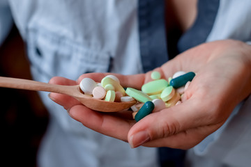 Medicine pills or capsules taking. Focus on pill