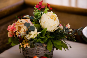 Candy bar with flowers, sweet cakes and decor items in bright colors.