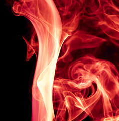 Naklejka premium Red smoke on black background