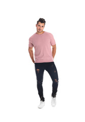 Young man in stylish jeans on white background