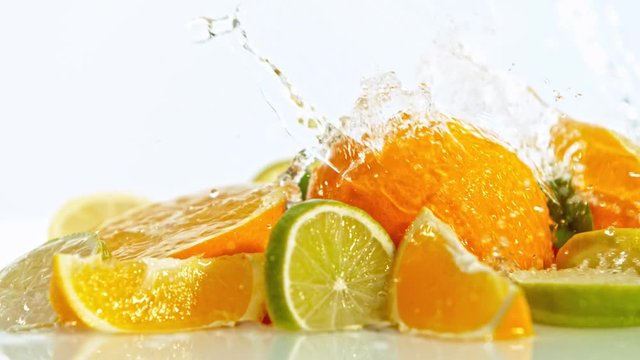 Splashing water on fresh citruses, shooted with high speed cinema camera at 1000 fps. 4K footage.