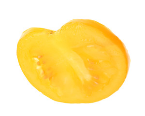 Fototapeta na wymiar Slice of yellow tomato on white background