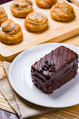Chocolate cake on white plate