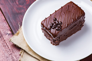 Chocolate cake on white plate