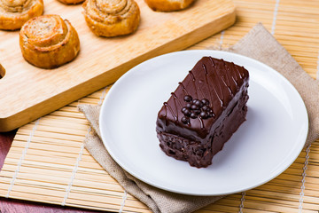 Chocolate cake on white plate