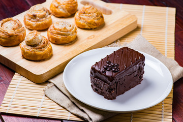 Chocolate cake on white plate