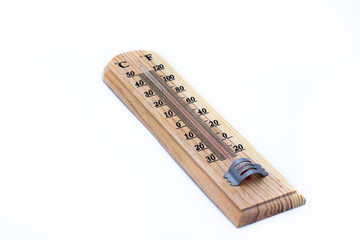 Close-up wooden thermometer scale isolated white background.