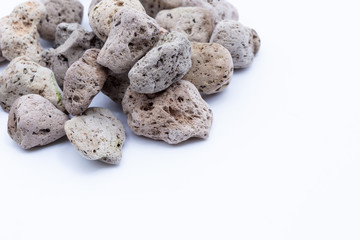 A natural piece of pumice stone isolated on white background.