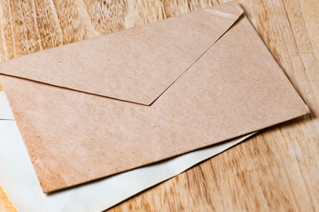 Envelopes on wooden background
