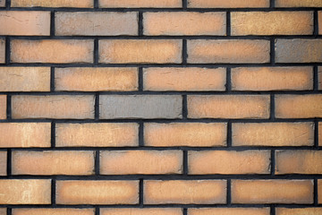 Orange brick wall closeup. Abstract texture background 