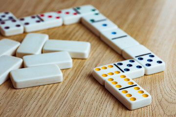 Domino tiles on wooden background
