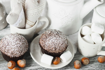 Chocolate cupcakes, marshmallow and different Christmas decorations