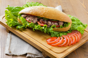 Tuna sandwich on wooden background