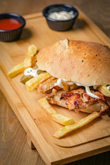 Delicious doner kebab on wooden background