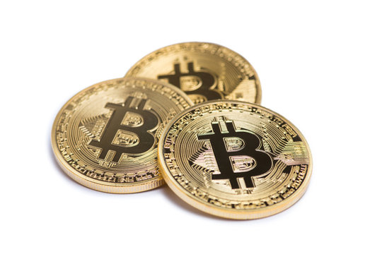 Golden bitcoin isolated on white