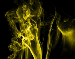 Yellow smoke on black background