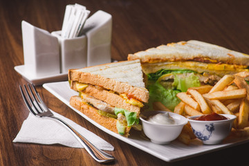 Club sandwich served with french fries