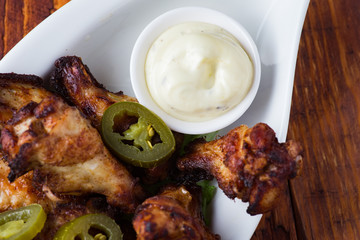 Fried chicken legs with jalopeno and mayonnaise