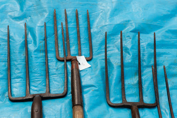 pitch forks for sale at the fair in Llanthony, Wales