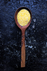 corn porridge in a wooden spoon
