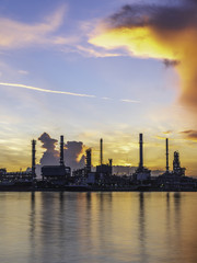 Obraz na płótnie Canvas Silhouette oil refinery and Petrochemical plant at dusk at sunrise