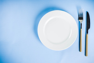 Table with a plate, fork and knife