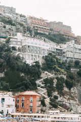 Obraz premium Views of the city of Sorrento in Italy, panorama and top view. Night and day, the streets and the coast. Beautiful landscape and brick roofs. Architecture and monuments of antiquity. Shops and street