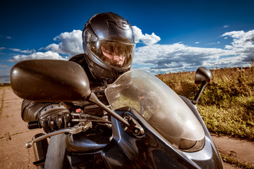 Biker racing on the road