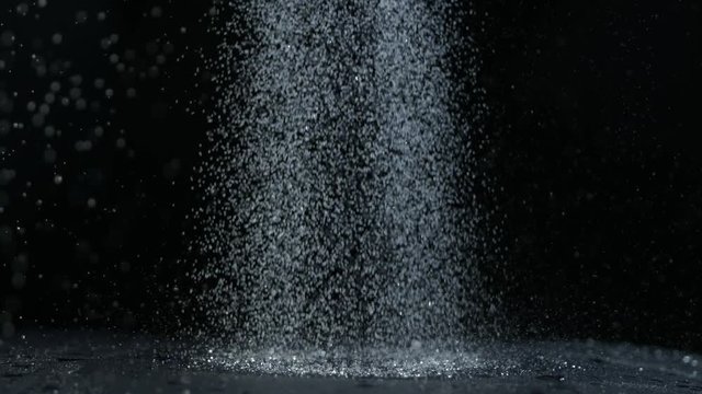 Shower rain on dark background, shooted with high speed cinema camera at 1000 fps. 4K footage.