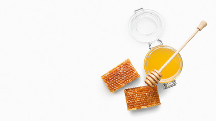 Jar full of fresh honey and honeycombs isolated on white