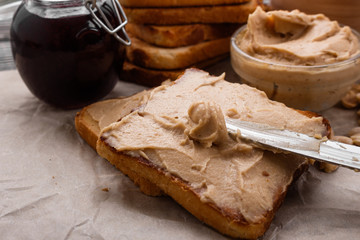 peanut paste on a wooden rustic background